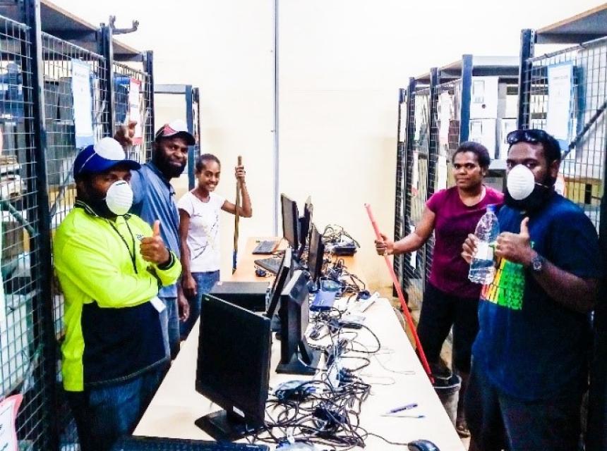 The Vanuatu Meteorology and Geohazards Department staff in action - scraping a few edges in the National Climate Archive room.